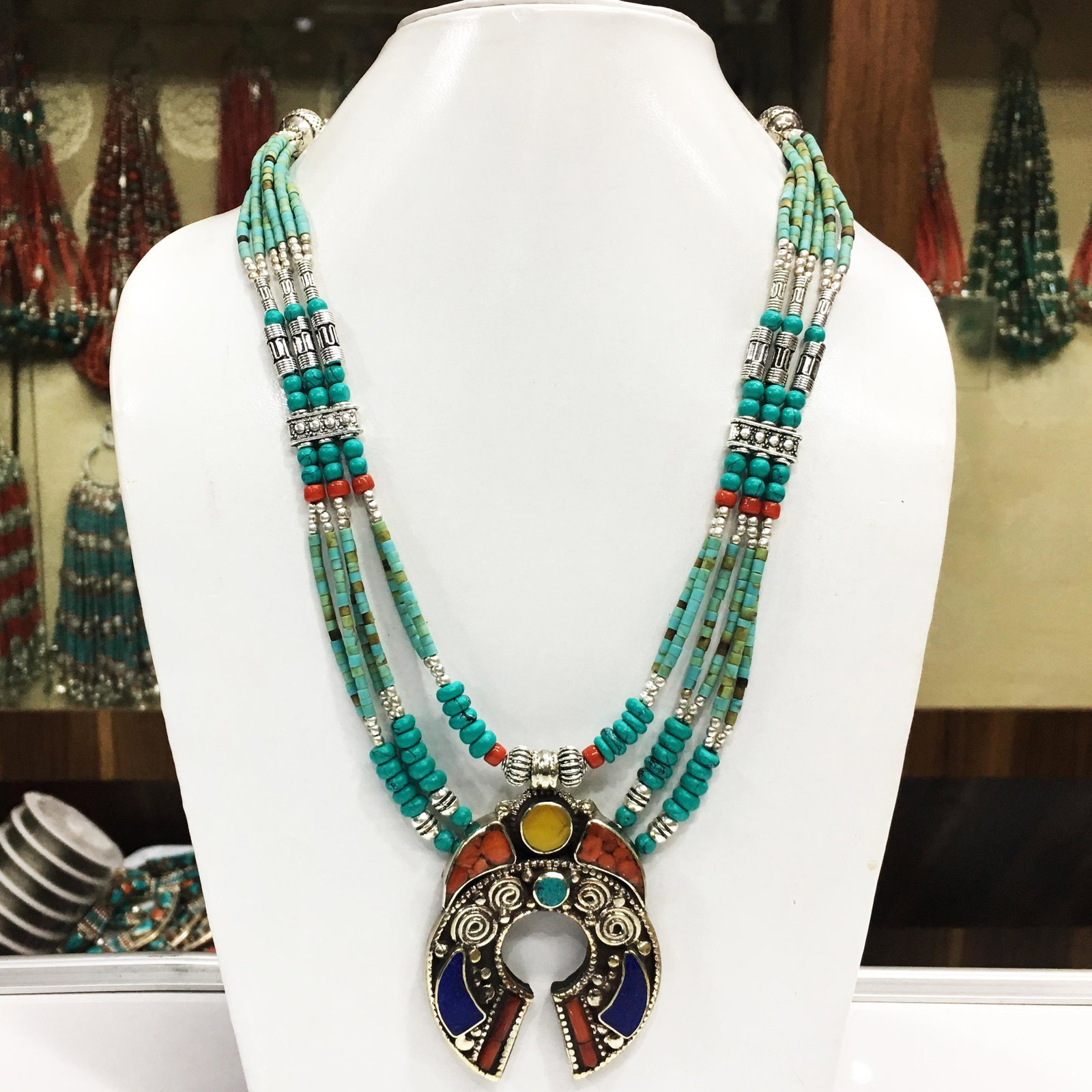 Tibetan Buddhist Turquoise & Coral Pendant Necklace: Tibet Natural Stone Hand Made Coral Necklace......This elegant Necklace was handcrafted in Tibet, the home of exquisite jewelry craftsmanship. It was skillfully made with large natural Turquoise, each