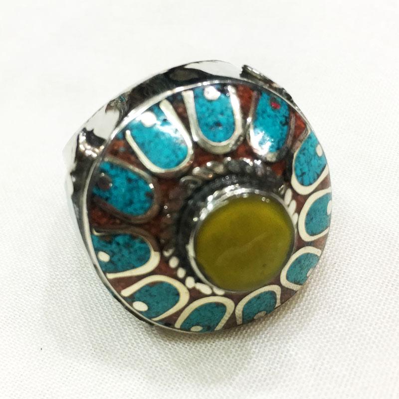 Tibetan Turquoise & Amber Hand Carved Ethnic Ring -: Tibetan Turquoise & Amber Hand Carved Ethnic Ring - 11MM Weight: 20 Gram Approx Gemstones: Turquoise & Amber Brand: Handmade Size: 11MM Country/Region of Manufacture: Nepal