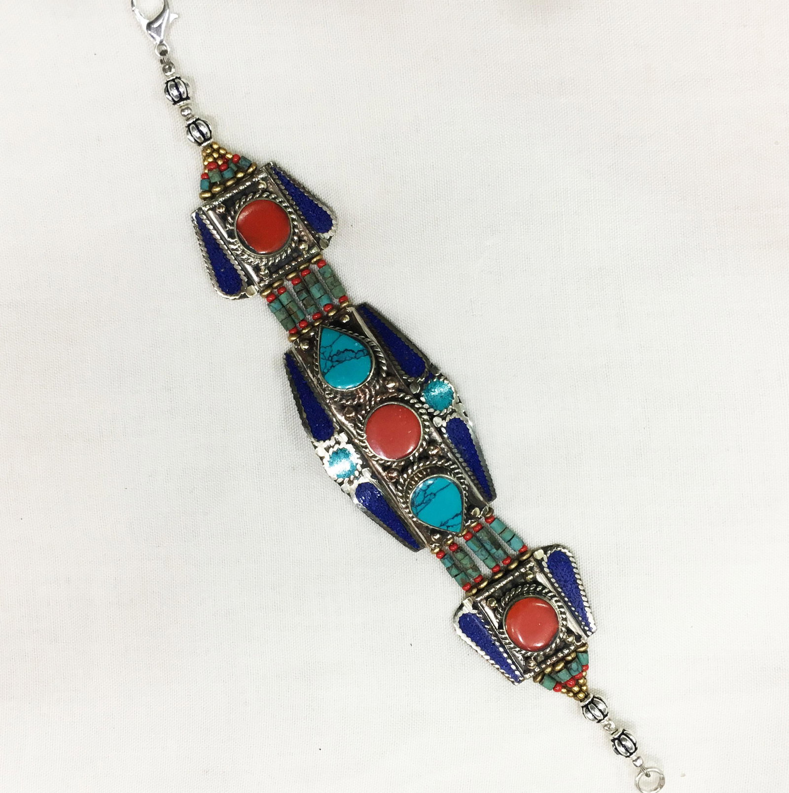 Ethnic Antique Choker Handmade Bracelet: TIBETAN TURQUOISE & CORAL HANDMADE BRACELETWeight: 30 Gram ApproxGemstones: Turquoise & Coral, LapisBrand: HandmadeBracelet Length: 6 to 7 InchCountry/Region of Manufacture: Kathmandu/Nepal