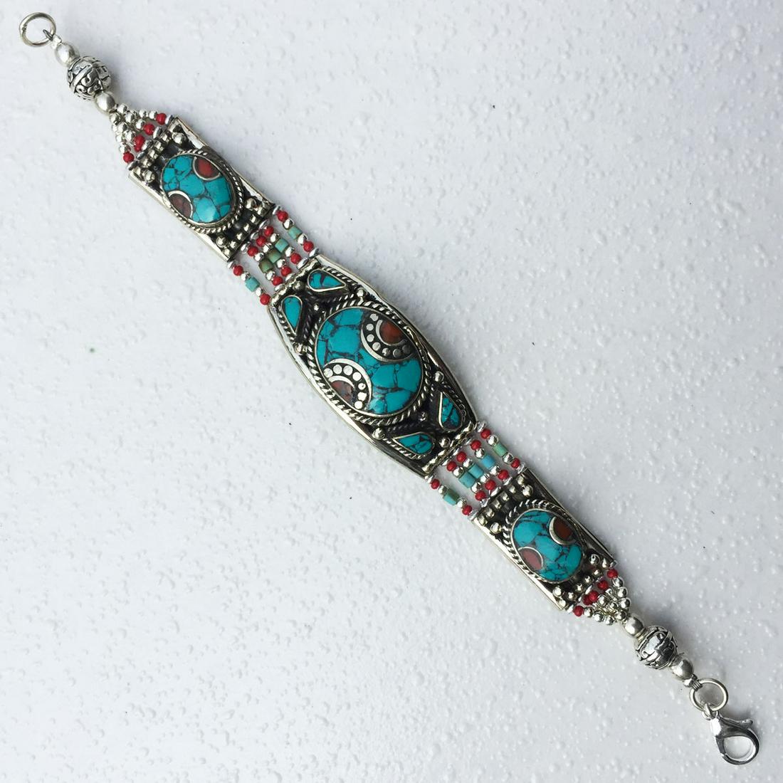 Nepalese Lapis & Turquoise Tibetan Bracelet: Tibetan Handmade Ethnic BraceletMain Stone: Turquoise & CoralMetal: Tibetan SilverLength (inches): 6 to 7Weight: 30 Gram ApproxMaterial: StoneBrand: HandmadeStyle: BohemianEthnic Origin: TibetanCountr