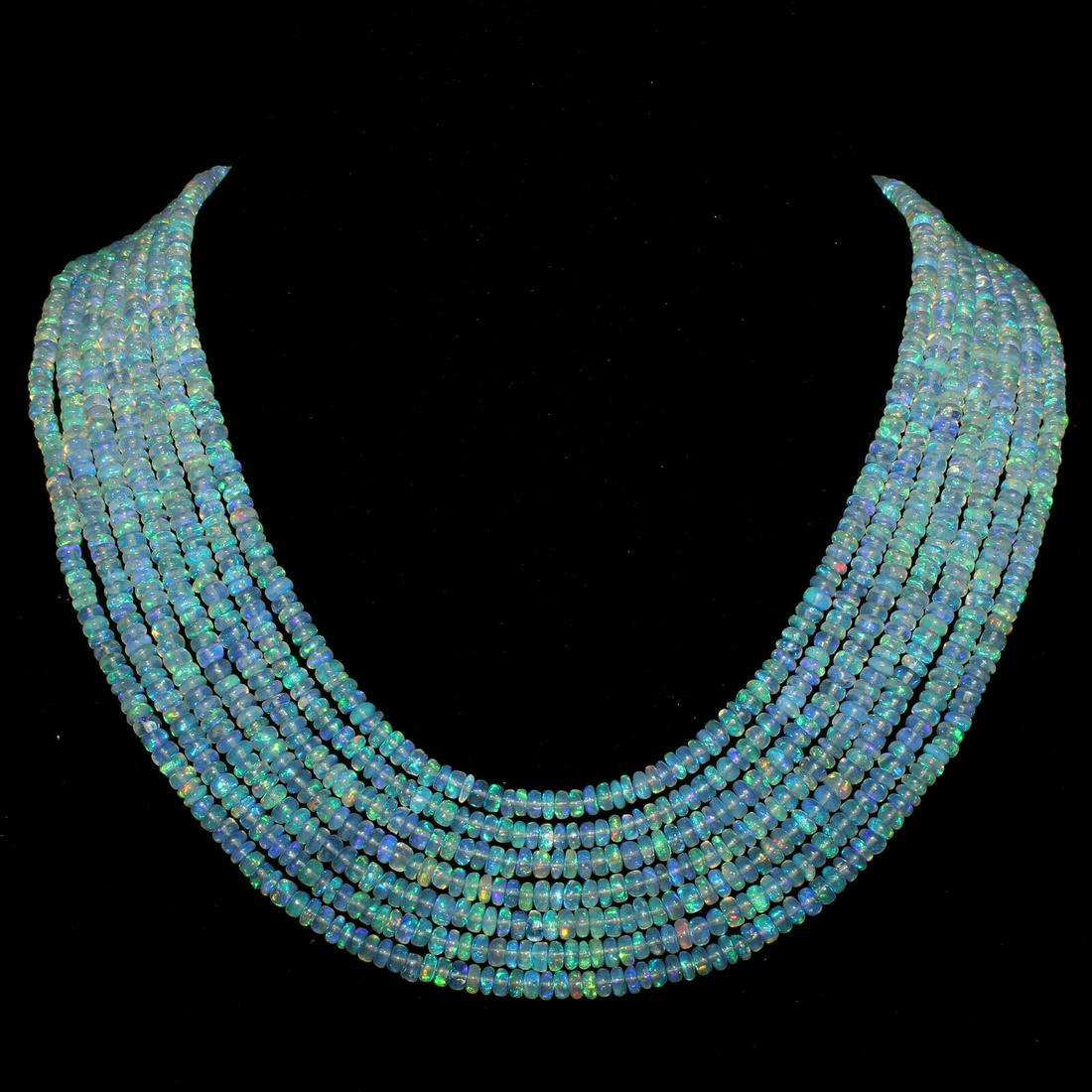 A+ 290Ct 7Strand Natural Ethiopian Welo fire Opal: Shape: BeadColor: Multi-ColorCountry of Origin: EthiopiaTransparency: Transparent Country/Region of Manufacture: IndiaTreatment: None (No Enhancement) Natural/Lab-Created: NaturalLength: 17InchTotal C