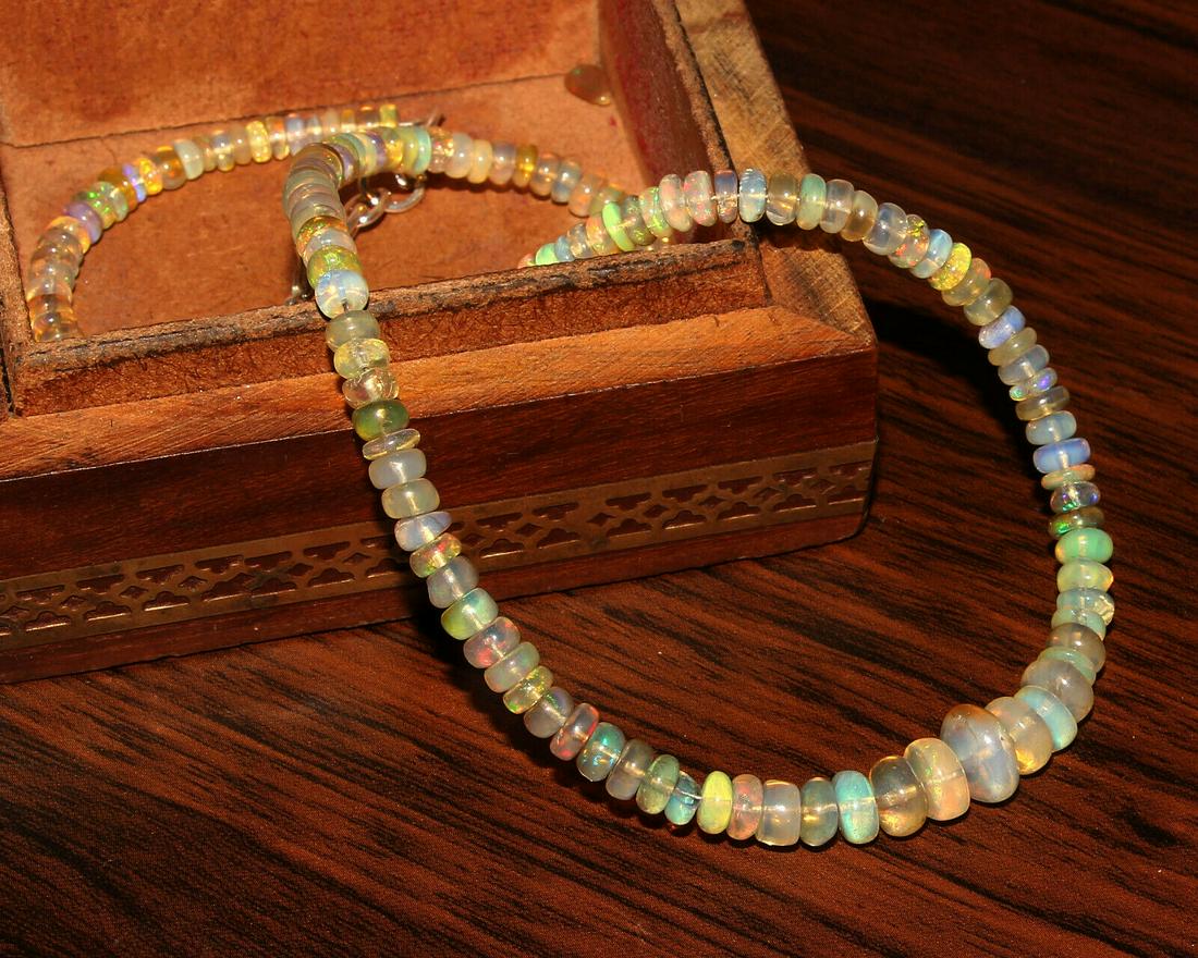 71CT Natural Ethiopian Welo fire Opal Beads Necklace: Shape: BeadCut Grade: Very Good Country of Origin: EthiopiaColor: Multi-ColorCountry/Region of Manufacture: IndiaTransparency: Transparent Natural/Lab-Created: NaturalTreatment: None (No Enhancement) 