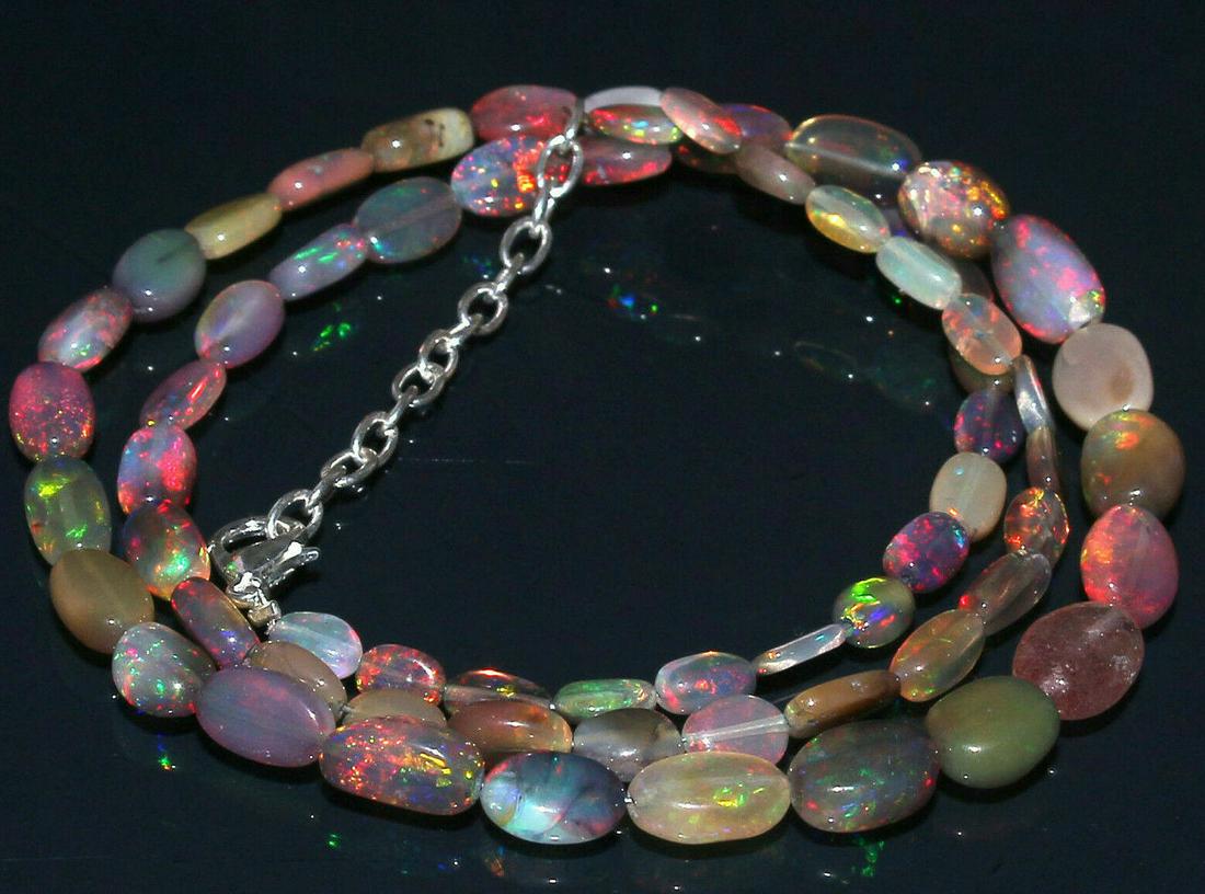Natural Ethiopian Welo fire Opal Nuggets Necklace: Shape: OvalCut Grade: Very Good Country of Origin: EthiopiaColor: Multi-ColorCountry/Region of Manufacture: IndiaTreatment: None (No Enhancement) Natural/Lab-Created: NaturalBrand: Gems TreasureLength