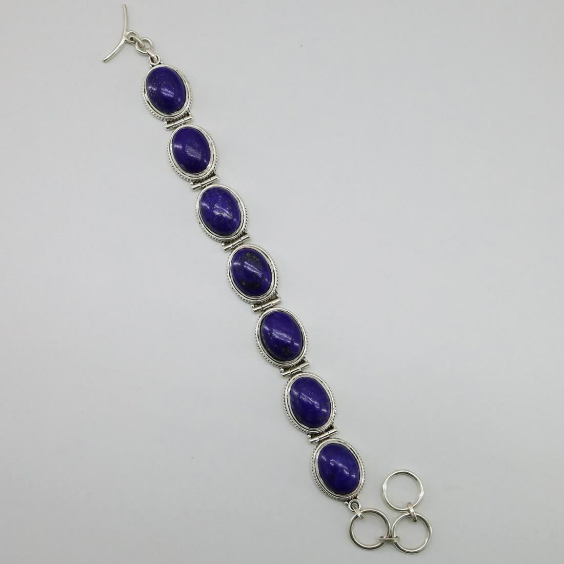 925 Sterling Silver Natural Lapis Lajuli Bracelet: This 925 Sterling Silver Natural Lapis Lajuli Bracelet is designed and hand crafted carefully from real Lapis Lajuli. Very special design.All parts are in a harmony with each other and this is a perfe