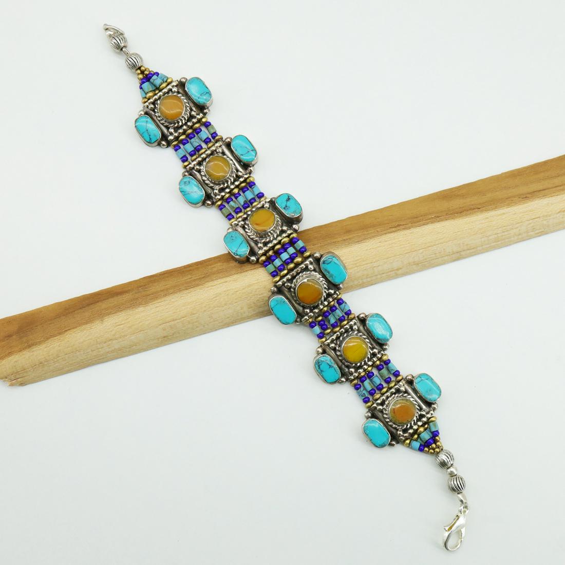 Tibetan Turquoise & Amber Handmade Ethnic Bracelet: TIBETAN TURQUOISE & CORAL HANDMADE BRACELETWeight: 30 Gram ApproxGemstones: Turquoise & Coral, LapisBrand: HandmadeBracelet Length: 6 to 7 InchCountry/Region of Manufacture: Kathmandu/Nepal