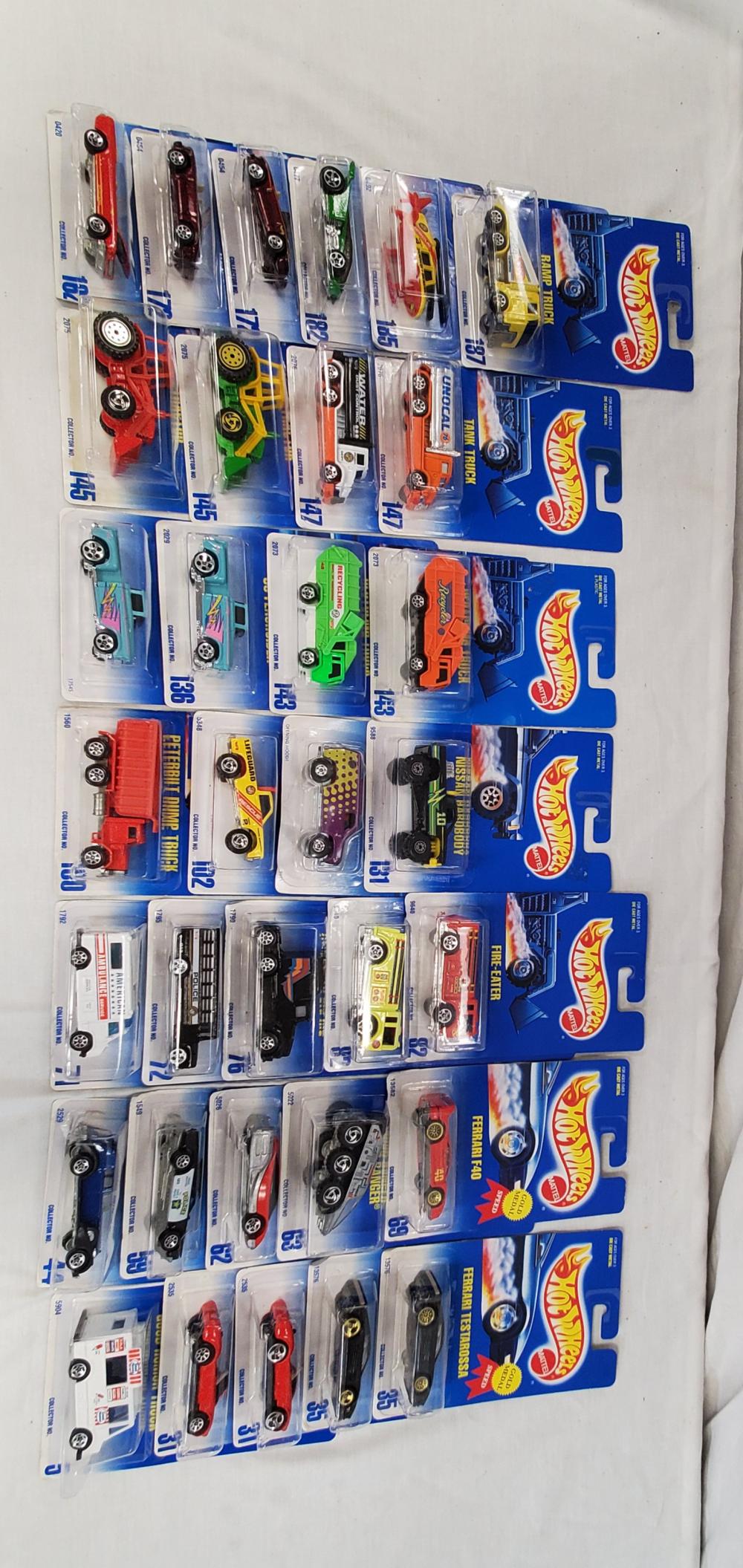 Lot of 33 new old stock Hot wheels Cars: all cars are mint on card and range from the 90's to the early 2000's