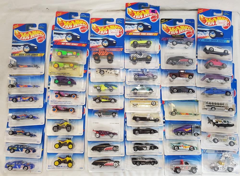 50 new old stock Hot wheels cars: all cars are mint on card and range from the 90's to the early 2000's