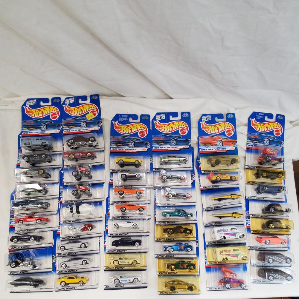 Lot of 49 Hot wheels cars new old stock on cards: all cars are mint on card and range from the 90's to the early 2000's