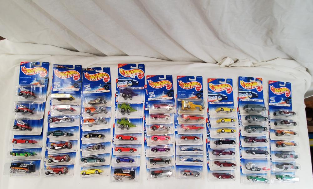 Lot of 62 Hot wheels cars new old stock on cards: all cars are mint on card and range from the 90's to the early 2000's