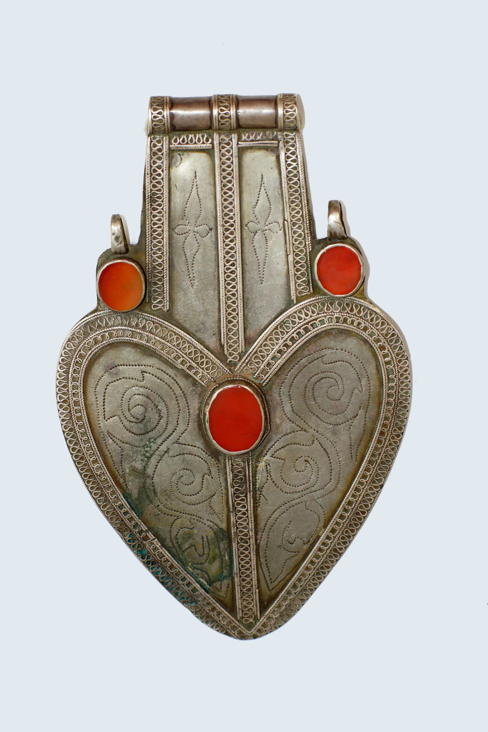 KAZAK SILVER HEART WITH CORNELIAN STONE, 19 C.: Large Kazak people silver heart-shaped pendant decorated with engraving and cornelian stones, second half of the 19th c. Size 6.5". Weight 101g.