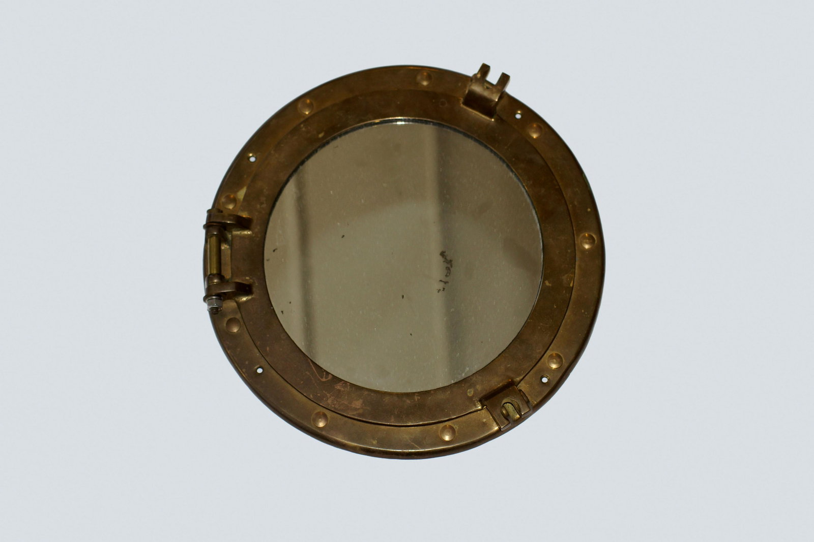 Antique Brass Porthole Mirror: Antique Brass Porthole Mirror. Nautical Maritime Wall Decor Ship Cabin Window. Opens to the left on hinge. Mirror Size 8". Full Size 12".