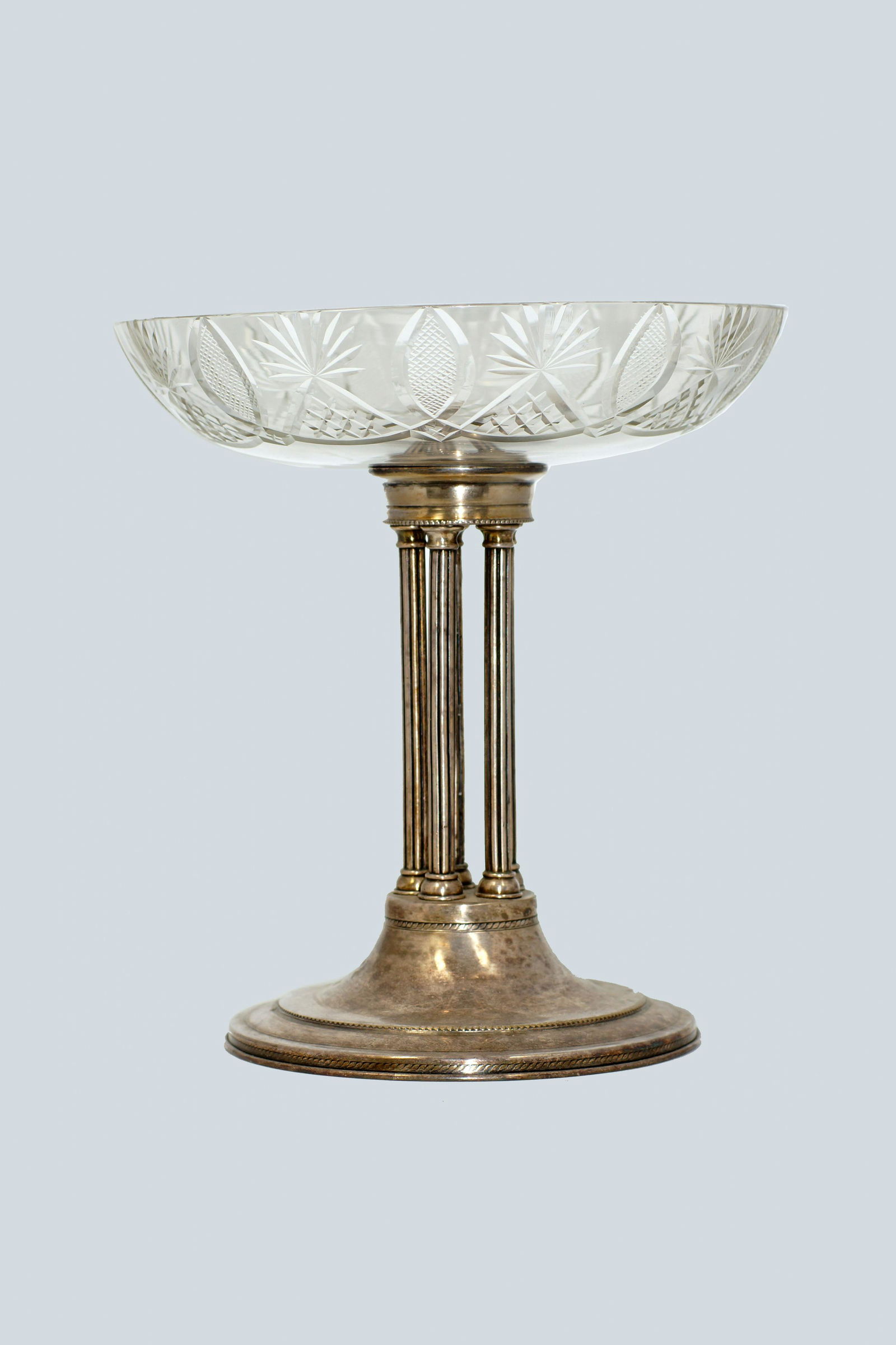 Vintage Russian crystal compote on silver pillars: Vintage Russian silver plated pillars with cut crystal compote/table center piece. Authentic Mark by Platinopribor Factory in Moscow. Size h 10.5".