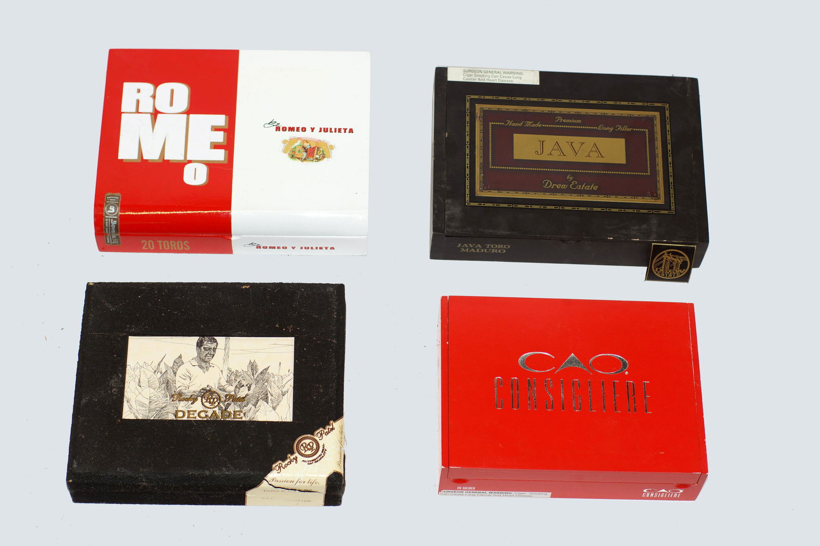 Vintage Cigar Boxes Mixed Lot of Four: Vintage Cigar Boxes Various Brands and Sizes. Lot of Four: Consigliere, Decade Toro, Java Drew Estate, Romeo by Romeo Y Julieta.