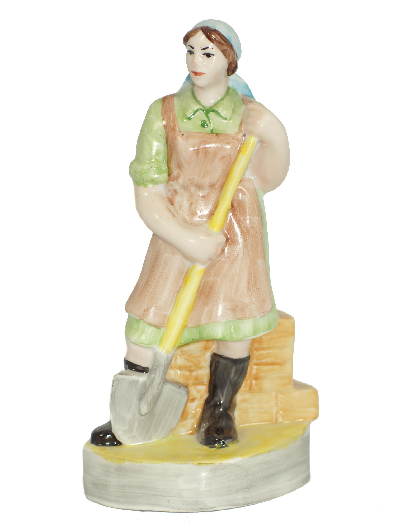 A Soviet Porcelain WWII Figurine Lady with Shovel: A Soviet Porcelain WWII Figurine. Soviet worker woman with a shovel. Size h 7".