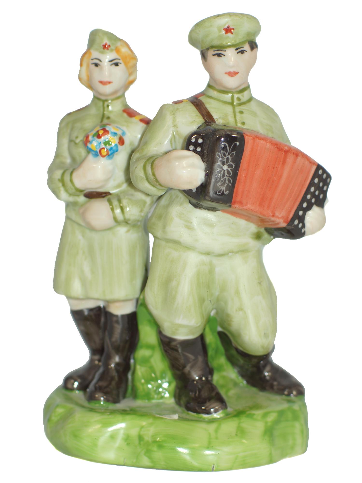 A Soviet Porcelain WWII Figurine Soldier Couple: A Soviet Porcelain WWII Figurine. Russian Soldier Couple with Harmonium. Signed by the Artist, Prisyazhnyuk. Size h 7".