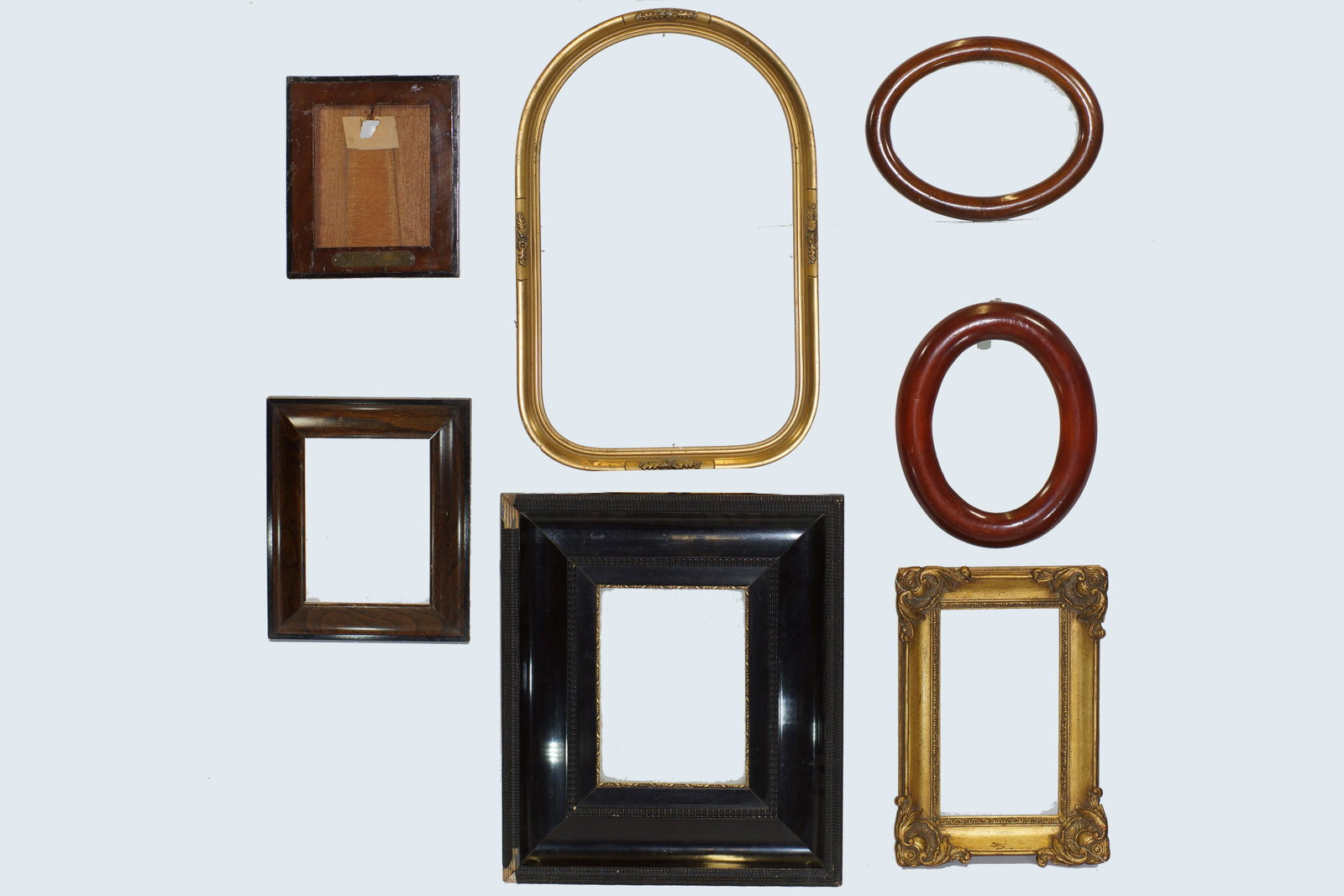 Lot of 7 Antique Mixed Wood Frames 19th Century: Antique 7 mixed wood frames of late 19th Century of different shapes and sizes. Largest 13" X 15". Smallest 6.5"x7.75".