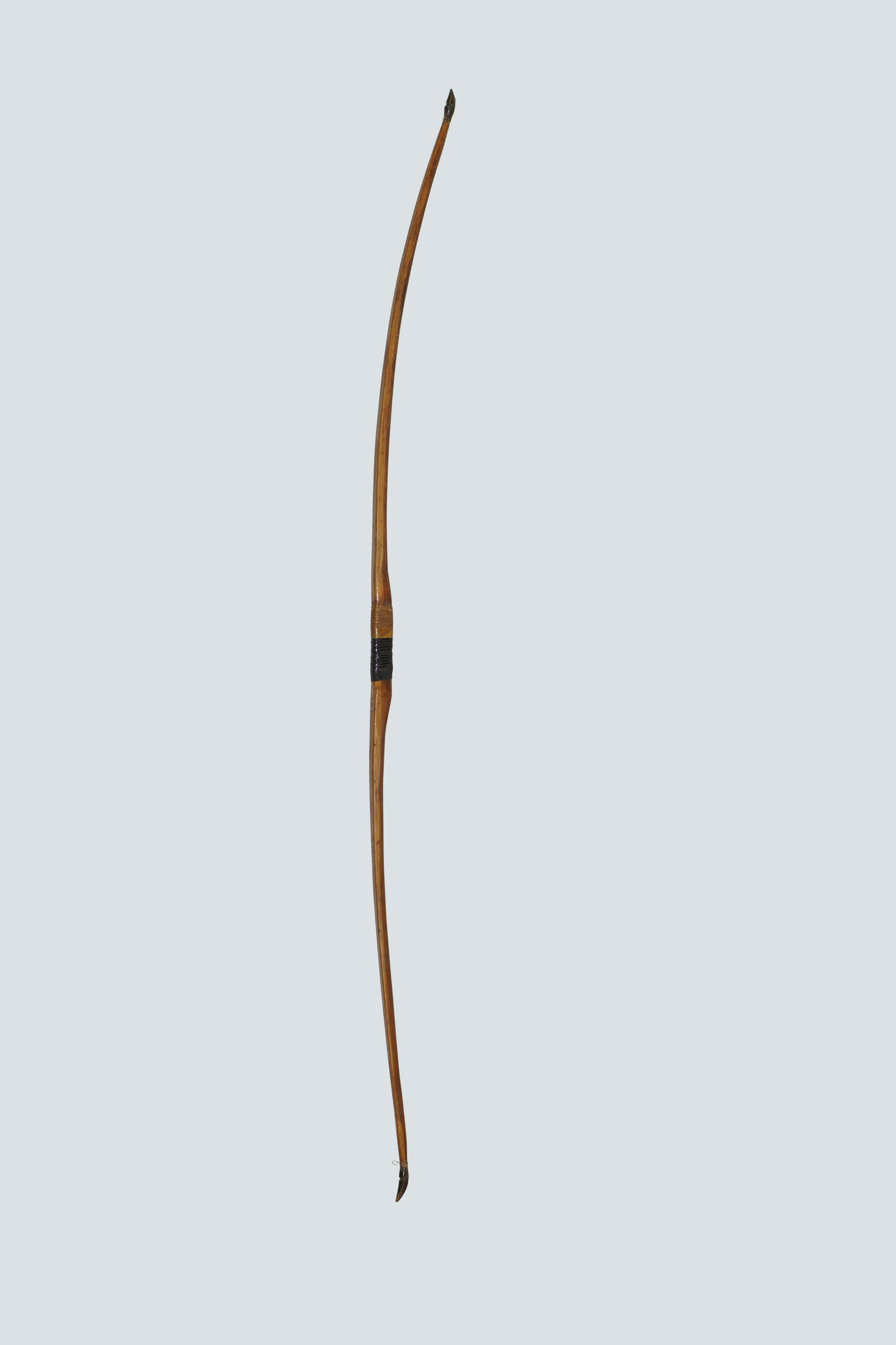 Antique Indian Long Bow: Long Wooden Indian bow with buffalo horn limb tips. Length Size: 60"