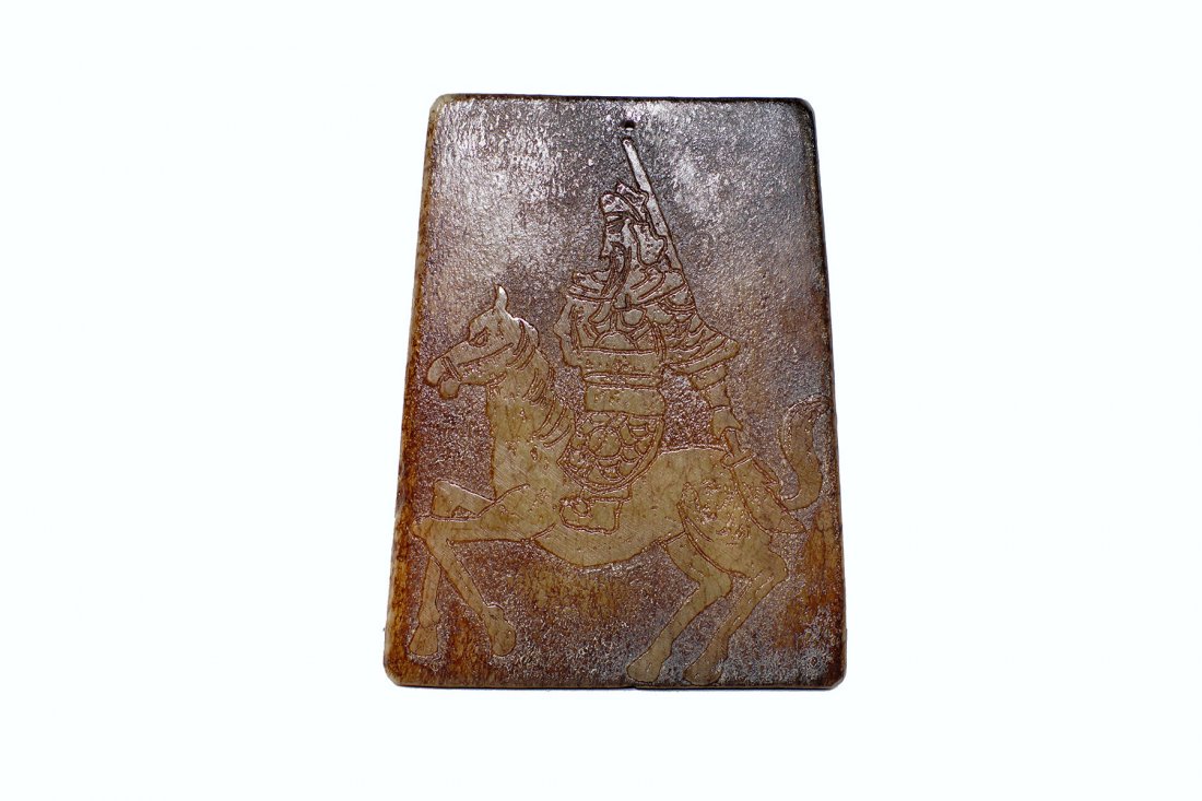 AN ANTIQUE ANCIENT CHINESE JADE PLAQUE: An antique ancient Chinese jade plaque with warrior on horse, decorated with a warrior in full armor on a horse. Marked with Chinese hieroglyphics on the back. Size: 3 x 3 3/4 x 1/4 in.