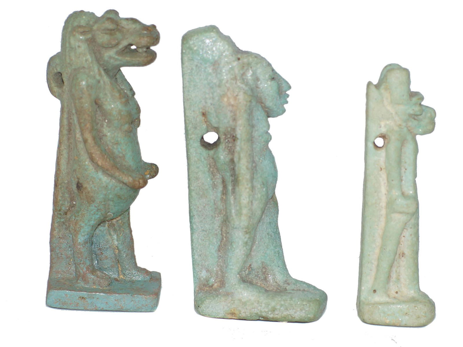 An Ancient Egyptian Faience Figurines Amulets Lot of 3: An Ancient Egyptian blue faience carved figurine amulets depicting Ancient Gods. Lot of Three. Size: 2 X 1/2 X 3/4; 2 X 1/2 X 3/4; 1 3/4 X 3/8 X 5/8 in.