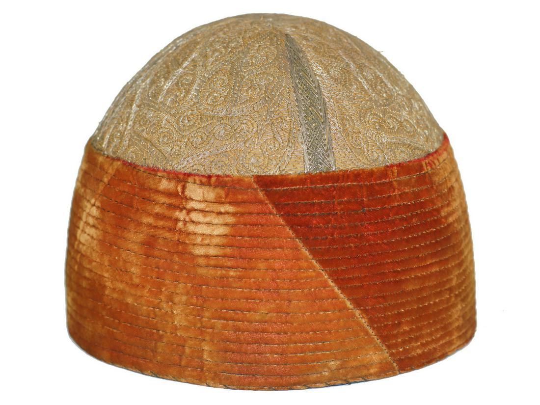 AN ISLAMIC EASTERN HAT WITH SILK LINE, 20TH CEN.: A Central Asian or Turkish hand-embroidered silk hat of a characteristic dervish headgear form. Dimensions: 6.5 x 8 in.