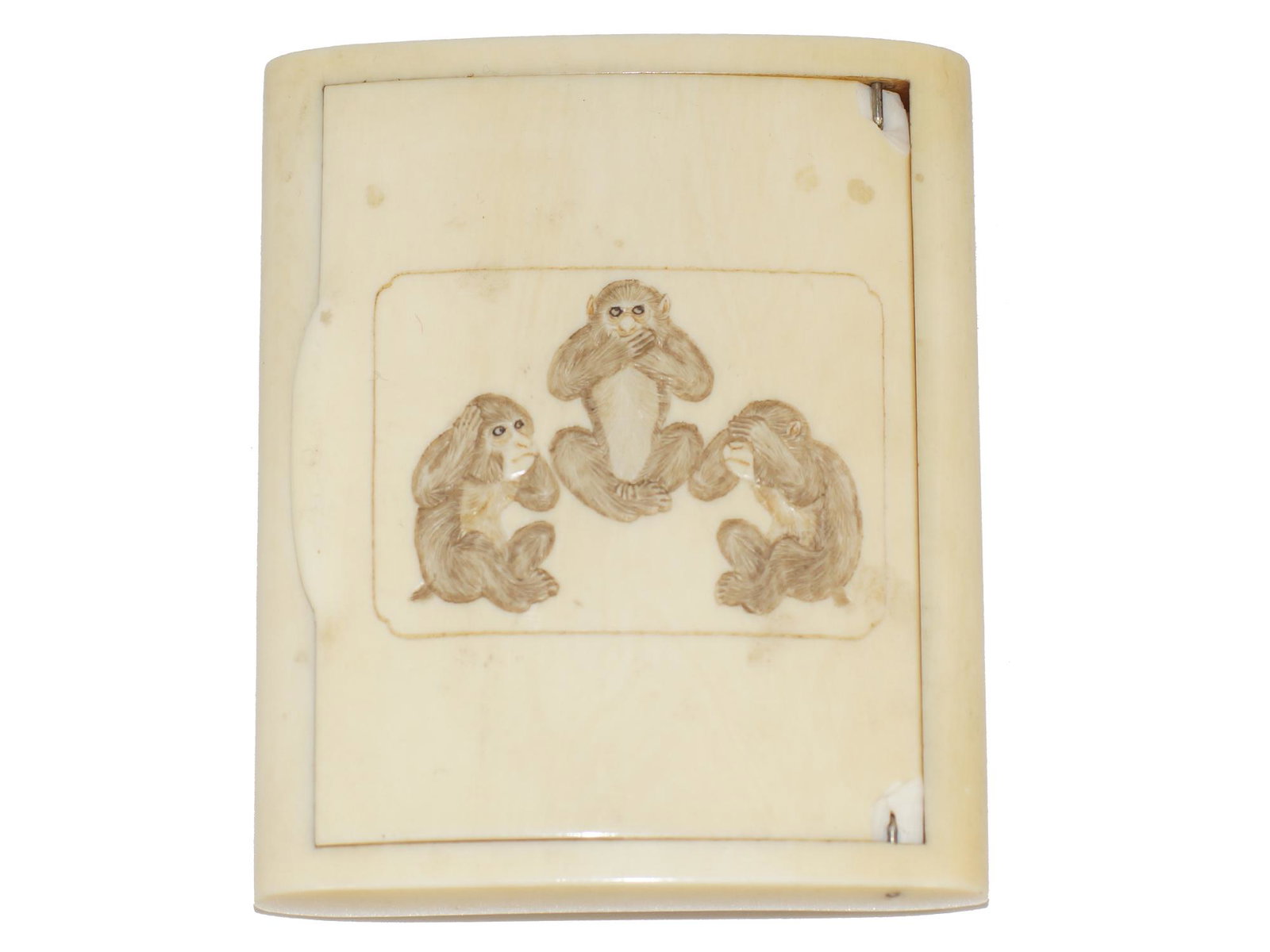ANTIQUE BONE CIGARETTE/MATCH CASE: Antique late 19th/early 20th century bone match or cigarette case with 3 baby monkey carvings. Dimensions: 0.5 x 2.75 x 3.25 in.