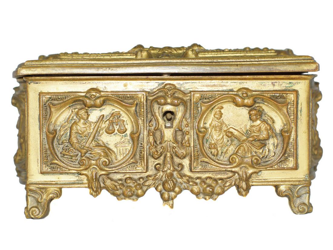 AN ANTIQUE QUEEN VICTORIAN BRASS JEWELRY BOX: An antique 1837-1897 Victorian relief brass casket/jewelry box to commemorate Queen Victoria's Diamond Jubilee. The brass box has velvet cushion interior and there is no key included. Dimensions: 3 x 