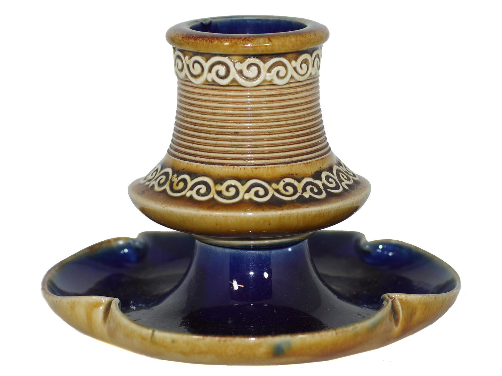 A VINTAGE DOULTON CERAMIC MATCH STRIKE/ASHTRAY: A vintage 1920's gold and blue ceramic match strike holder with an ashtray on the bottom. Manufactured and marked by Doulton Lambeth, England. Dimensions: H 3.75 x D 5.5 in.