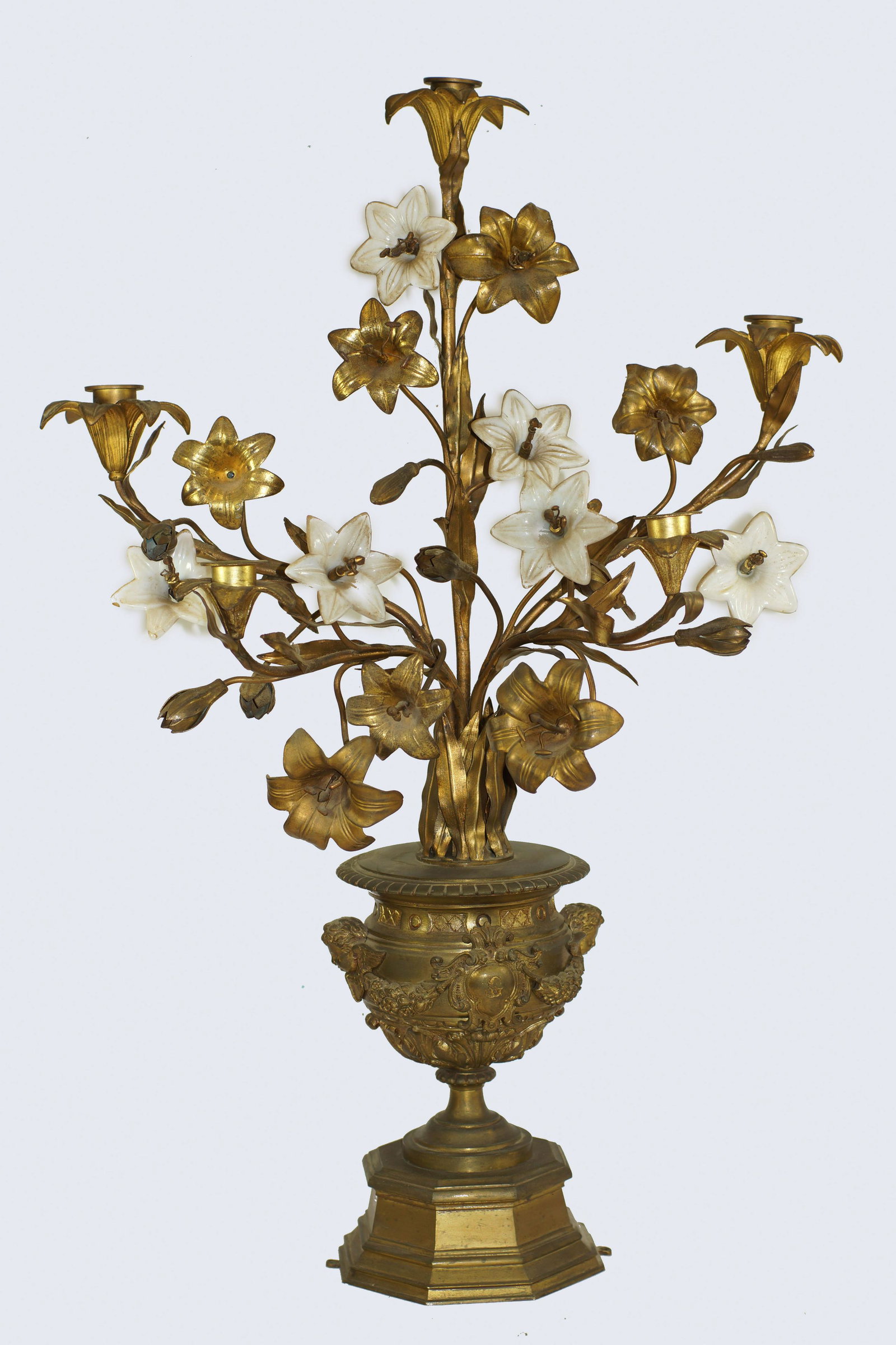 AN ANTIQUE FRENCH LOUIS XV STYLE BRONZE LAMP: Gilt and patinated bronze figural five-light candelabra with bisque porcelain flower mounts. Circa 19th century. Dimensions: H 28 in.