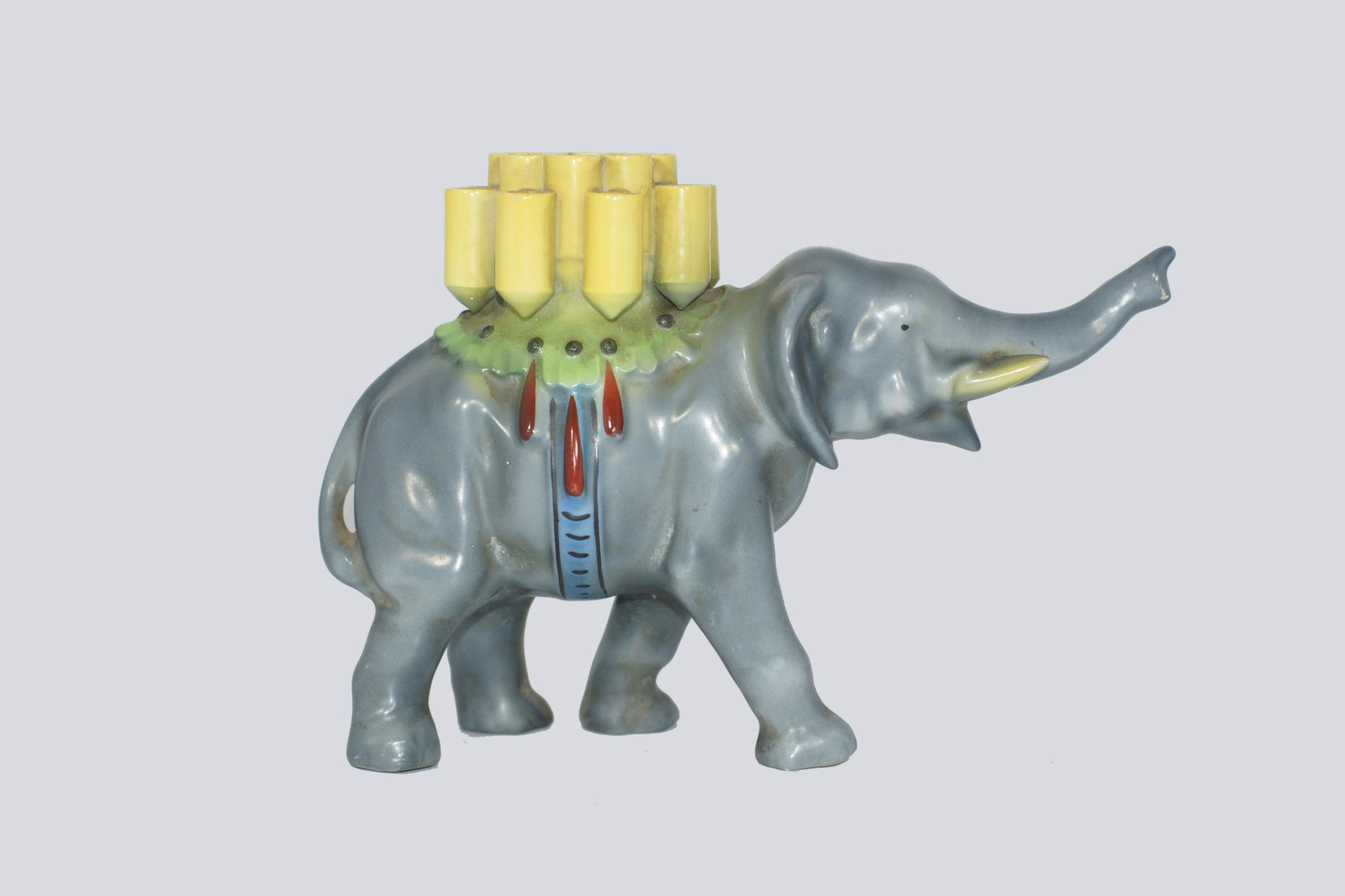 A BAVARIAN PORCELAIN ELEPHANT CIGARETTE HOLDER: A very rare 1930's Bavaria, Germany porcelain elephant cigarette holder. Stamped BAVARIA. Dimensions: H 6 x L 8.5 in.