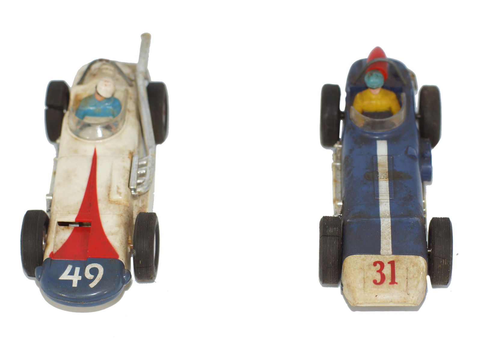 TWO VINTAGE MARX INDIANAPOLIS RACE SLOT CARS: Two vintage MARX SEARS ALLSTATE Slot Car #49 Indy Car 1/32 Scale and #31 Indy Car 1/32 Both cars do have age and use wear. some of the rubber tires have cracks. Dimensions: 2 x 2.25 x 6 in.