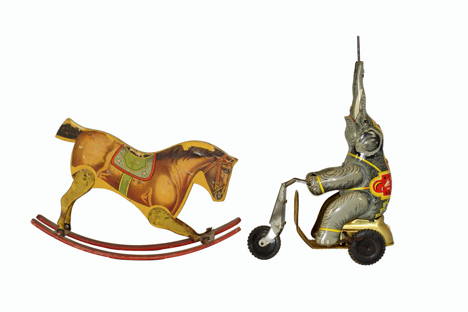 A GROUP OF VINTAGE TIN TOYS: A circus elephant on the bike tin wind-up toy and vintage riding horse. Dimensions: Horse: 5.25 x 8.5 in. Elephant: 6 x 9.25 in.