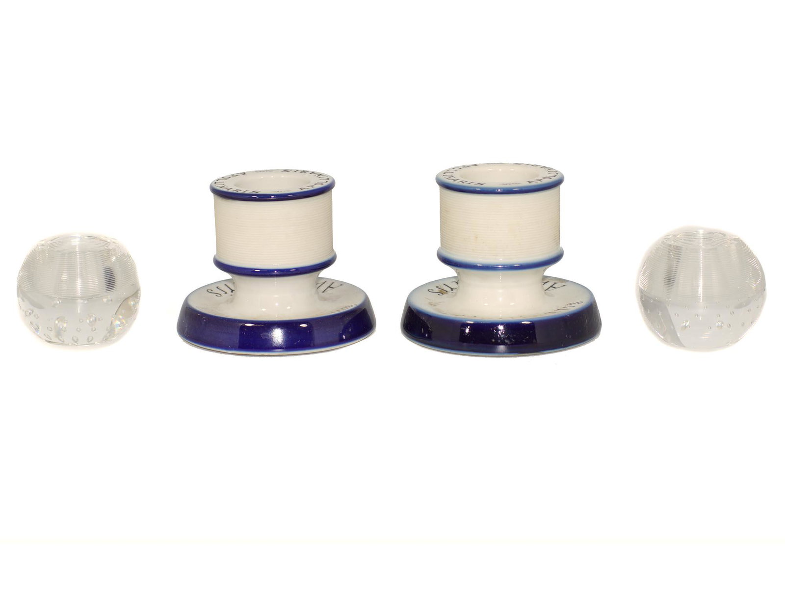 A VINTAGE ADVERTISING FRENCH MATCH HOLDER STRIKER: A group of four match strikers and ashtrays. Pair of vintage French advertising porcelain match holder and striker. Advertising Apollinaris liquor this blue and white cafe match strike has a ridged ce
