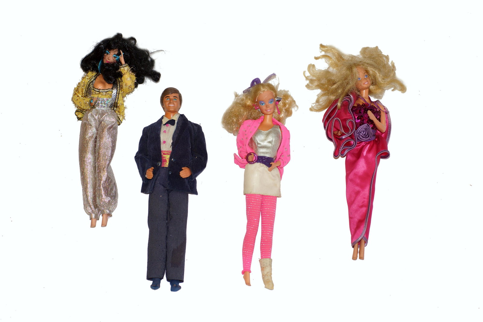 A GROUP OF COLLECTIBLE VINTAGE BARBIE DOLLS: Four vintage Barbie dolls, all made by Mattel Inc. Circa 1966. Dimensions: Smallest: H 11.25 in. Largest: H 11.75 in.