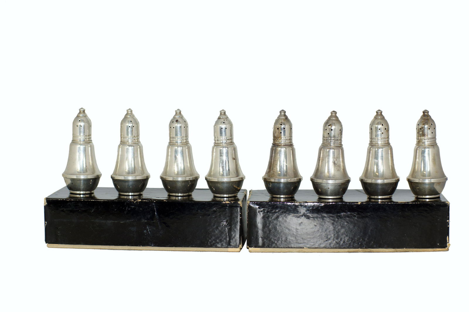 TWO SETS OF WEIGHTED STERLING SILVER SALT SHAKERS: Vintage Duchin Creations fine table sterling silver salt and pepper shakers. All market weighted sterling silver. In original boxes. Circa 1940-1950's. Dimensions: H 3.5 in.