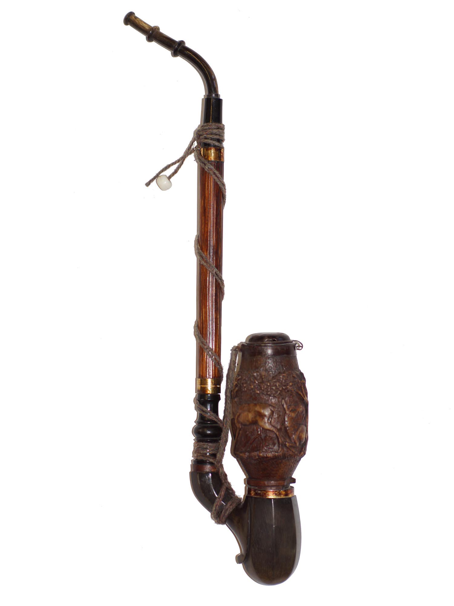 AN GERMAN ANTIQUE HAND CARVED WOOD SMOKING PIPE: A unique long hand-carved smoking pipe, depicting a forest scene with deer. Circa early 1900's. Dimensions: L 16 in.