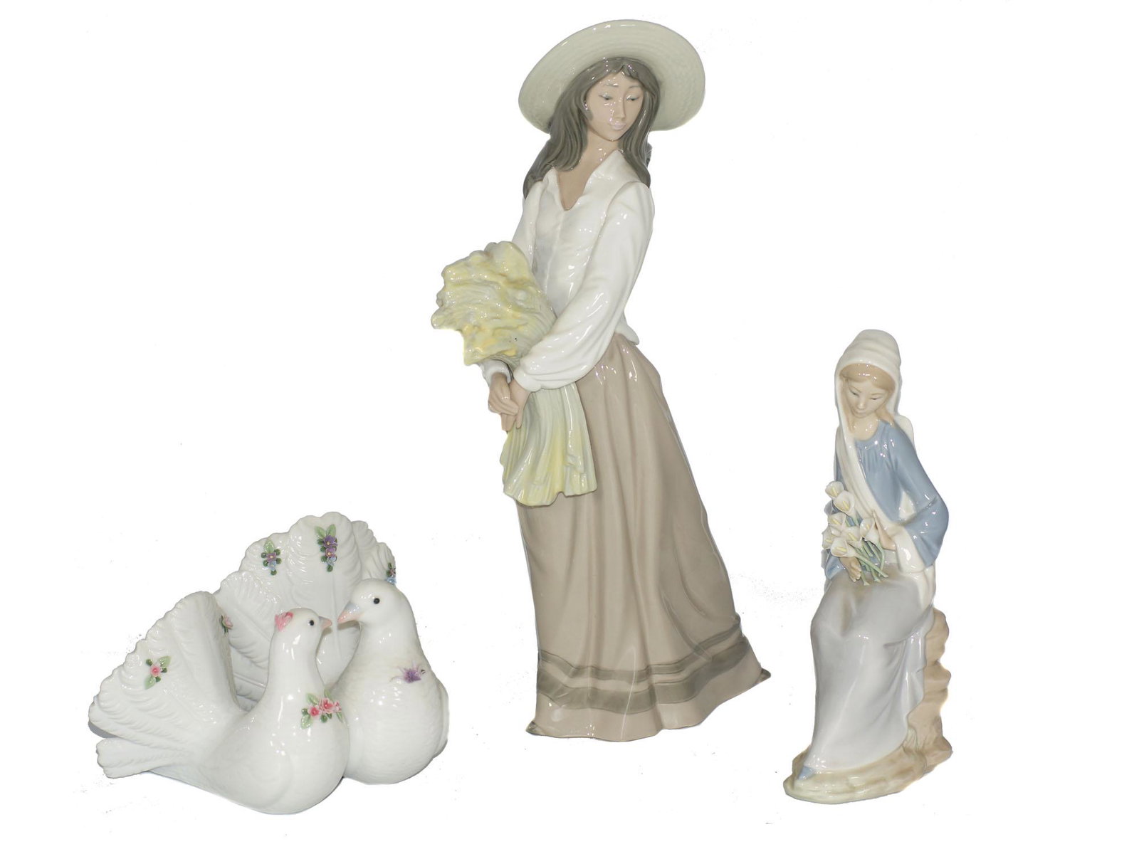 ANTIQUE LLADRO PORCELAIN FIGURINES: First Item: Nao by Lladro woman with wheat porcelain figurine. Made in Spain. Second Item: Lladro Girl Sitting with Calla Lilies Porcelain Figurine. Made in Spain. Third Item: Lladro Couples of Doves 