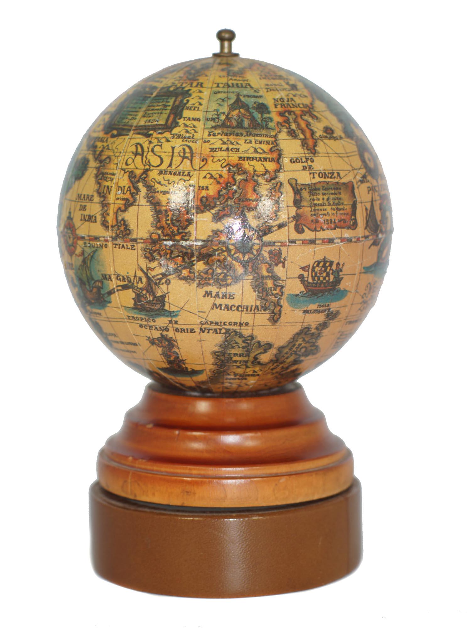 VINTAGE MUSIC UNWINDING GLOBE MONEY BANK: Vintage globe money bank which unwinds and plays peaceful music. The money bank includes a lock and key. The money bank is unmarked by the manufacturer. Dimensions: H 7 in.