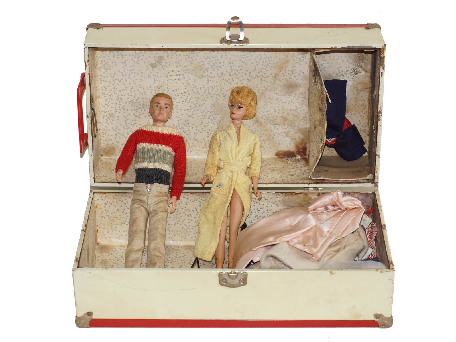 A VINTAGE RARE FIRST EDITION BARBIE AND KEN DOLL: Very rare set of two first edition dolls. Vintage 1960 ash blonde bubble cut Barbie, Mattel Inc. Vintage MCMLX 1960 First Ken Doll, Mattel Inc. Vintage metal doll suitcase with Barbie and Ken clothing