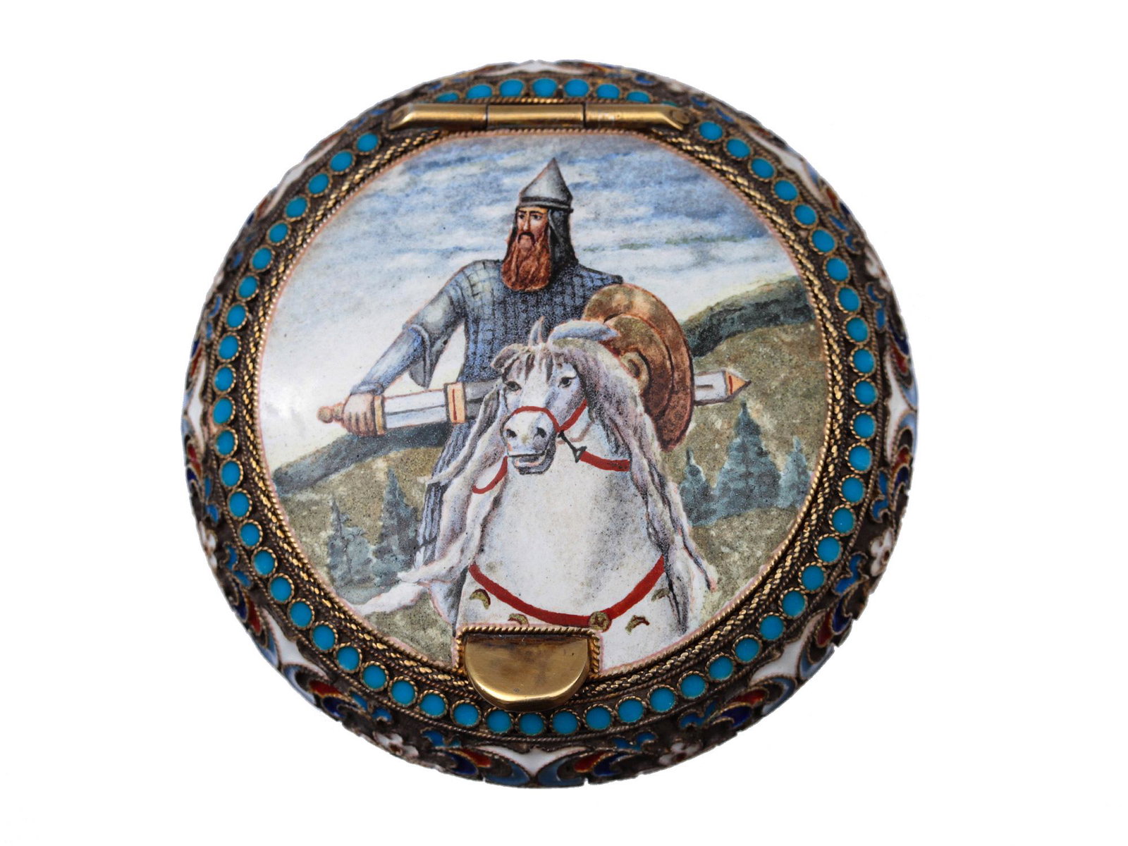 A RUSSIAN SILVER AND CLOISONNE ENAMEL SNUFF BOX: On the lid of the box is an image of a bogatyr' (hero of Russian epics) copying the image of Dobrynia from the famous painting by V. Vasnetsov. The image is surrounded by a border of turquoise dots. T