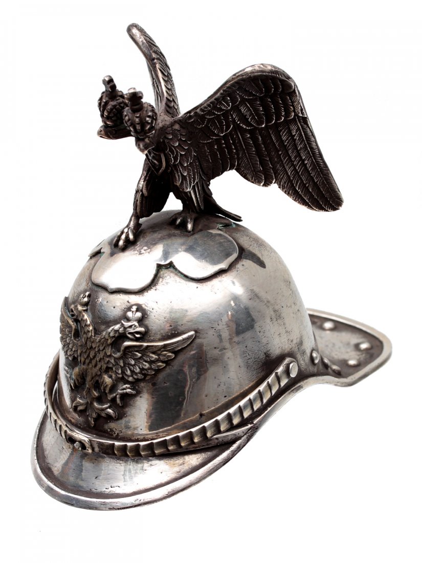 A RUSSIAN GILT-SILVER HELMET STIRRUP CUP. 20TH C.: A very interesting silver stirrup cup in the shape of the Imperial Russian Horse Guards helmet. The emblem in the center and the sculptural top are in the form of a two-headed eagle with two imperial 