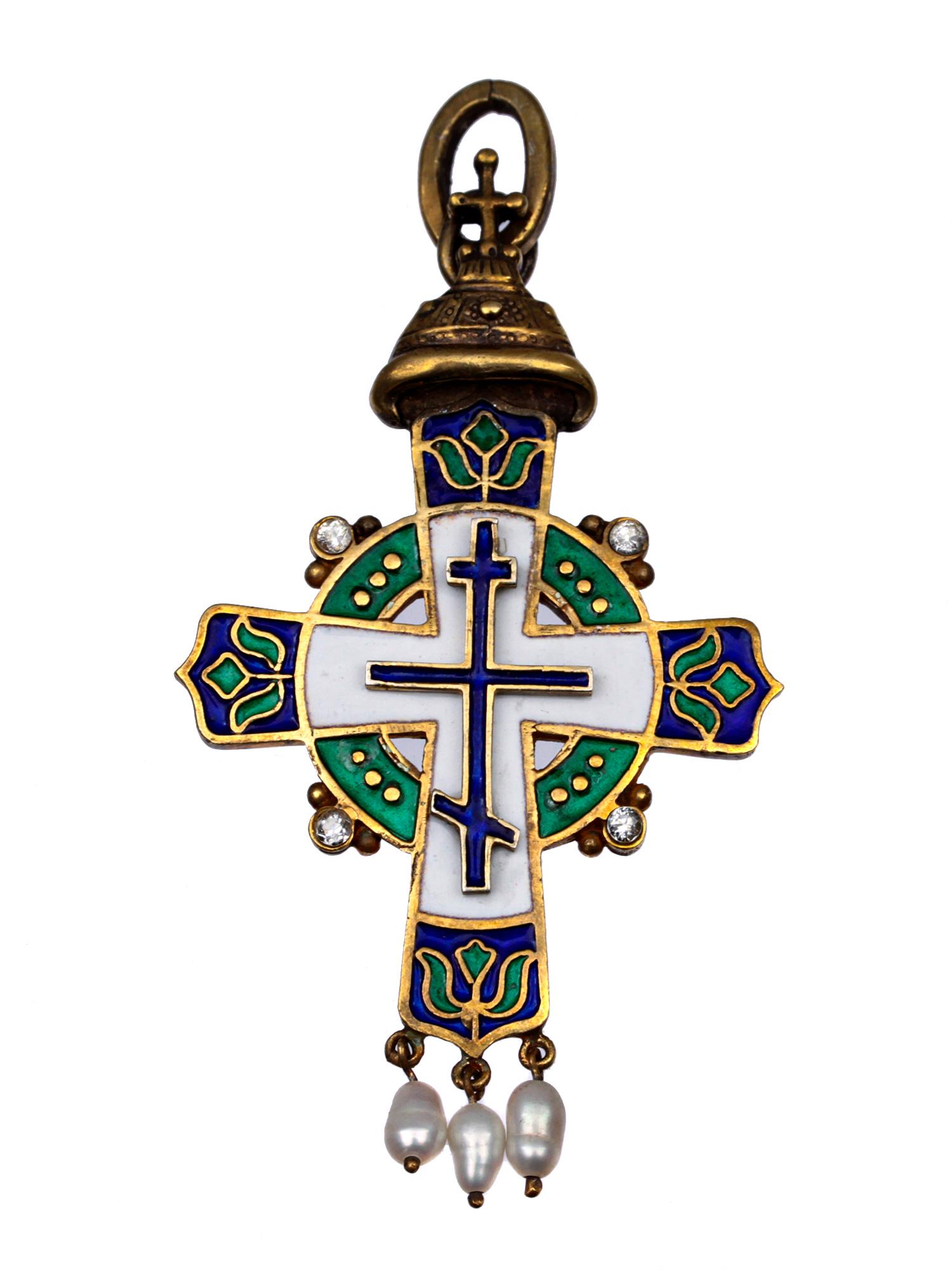 A RUSSIAN ORTHODOX ENAMEL GILT-SILVER CROSS: A crucifix necklace is decorated with three oval pearls. Surmounted by the Hat of Monomakh, an ancient crown of Russian tsars. Russian hallmarks on the hanging link. 88 silver standard. Weight: 0.7 oz