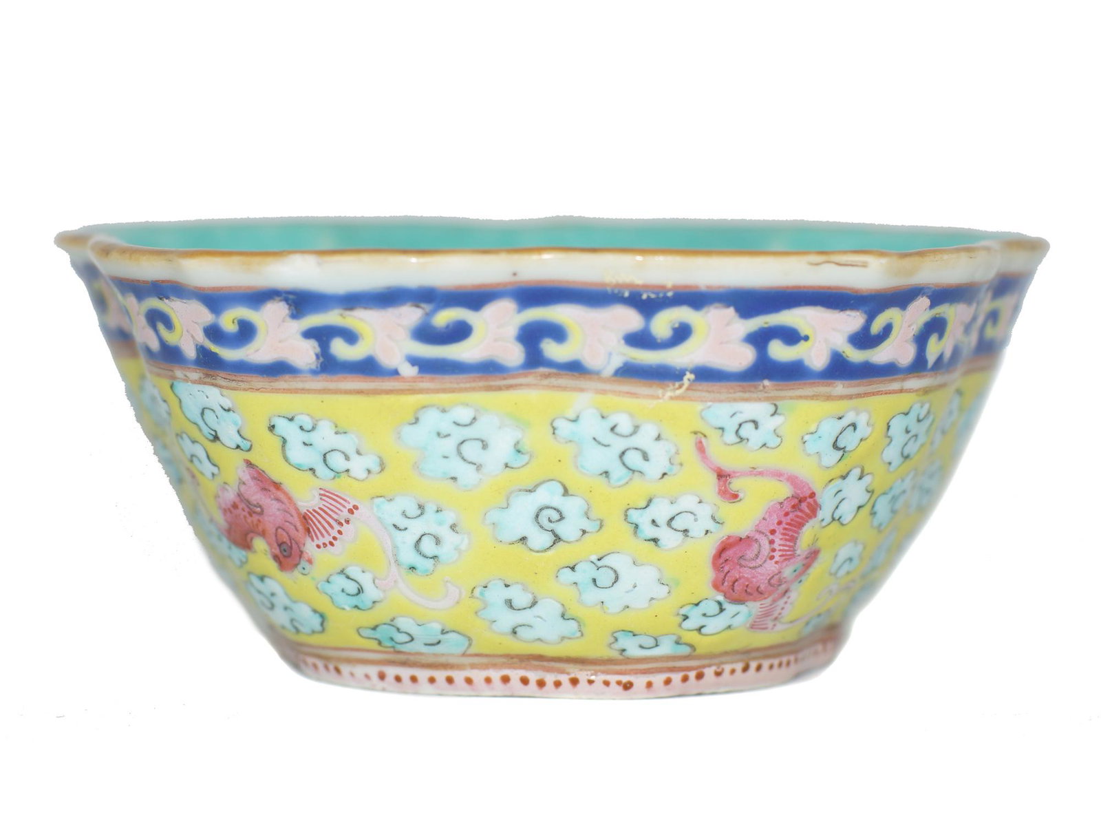 An Antique Chinese Yellow Ground Porcelain Bowl: A cup featuring a gilded rim, decorated with auspicious bat and geometrical design in a famille vert on an egg yolk yellow ground. Interior of bowl is a beautiful turquoise. Underside with red under g