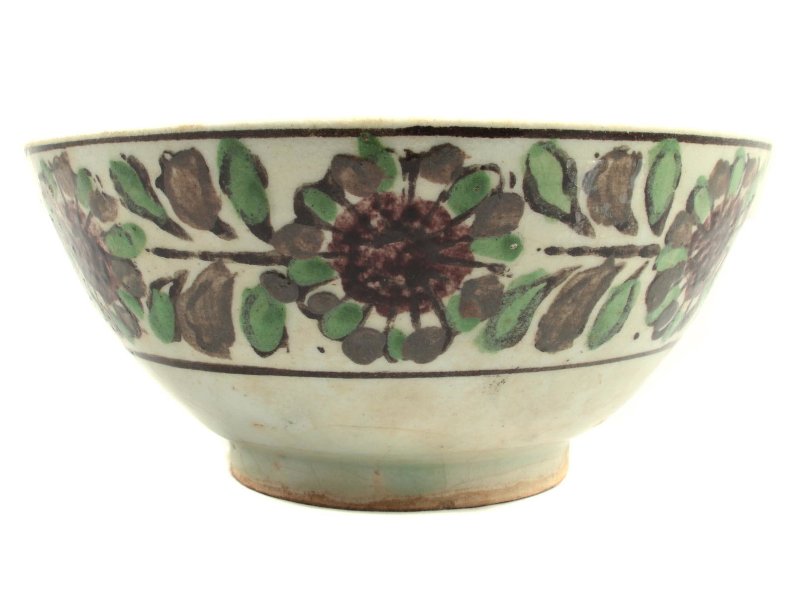 A LARGE ANTIQUE CERAMIC BOWL. SPAIN. 18-19TH C.: A Bowl with a pale green glaze and floral design with browm, green and black colours. The glaze has cracks and minor injuries commensurate with age, but in general, the bowl is in excellent condition.