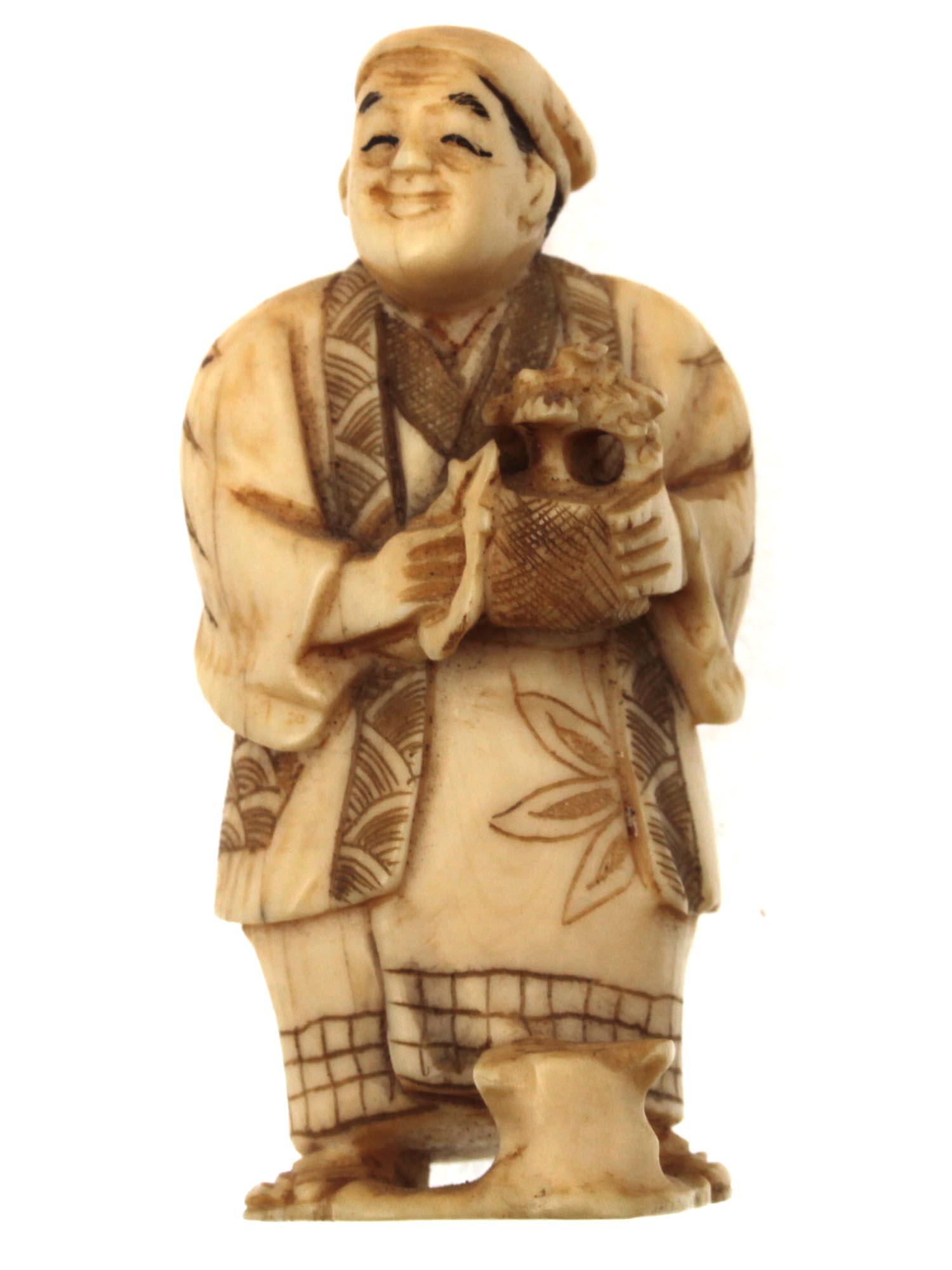 A JAPANESE HAND CARVED NETSUKE OKIMONO 19TH C.: An original hand carved okimono featuring a man holding Bonsai tree and pruning shears. Remarkably detailed facial features and patterns on clothes. Character markings on bottom. Dimensions: H: 2 in.,
