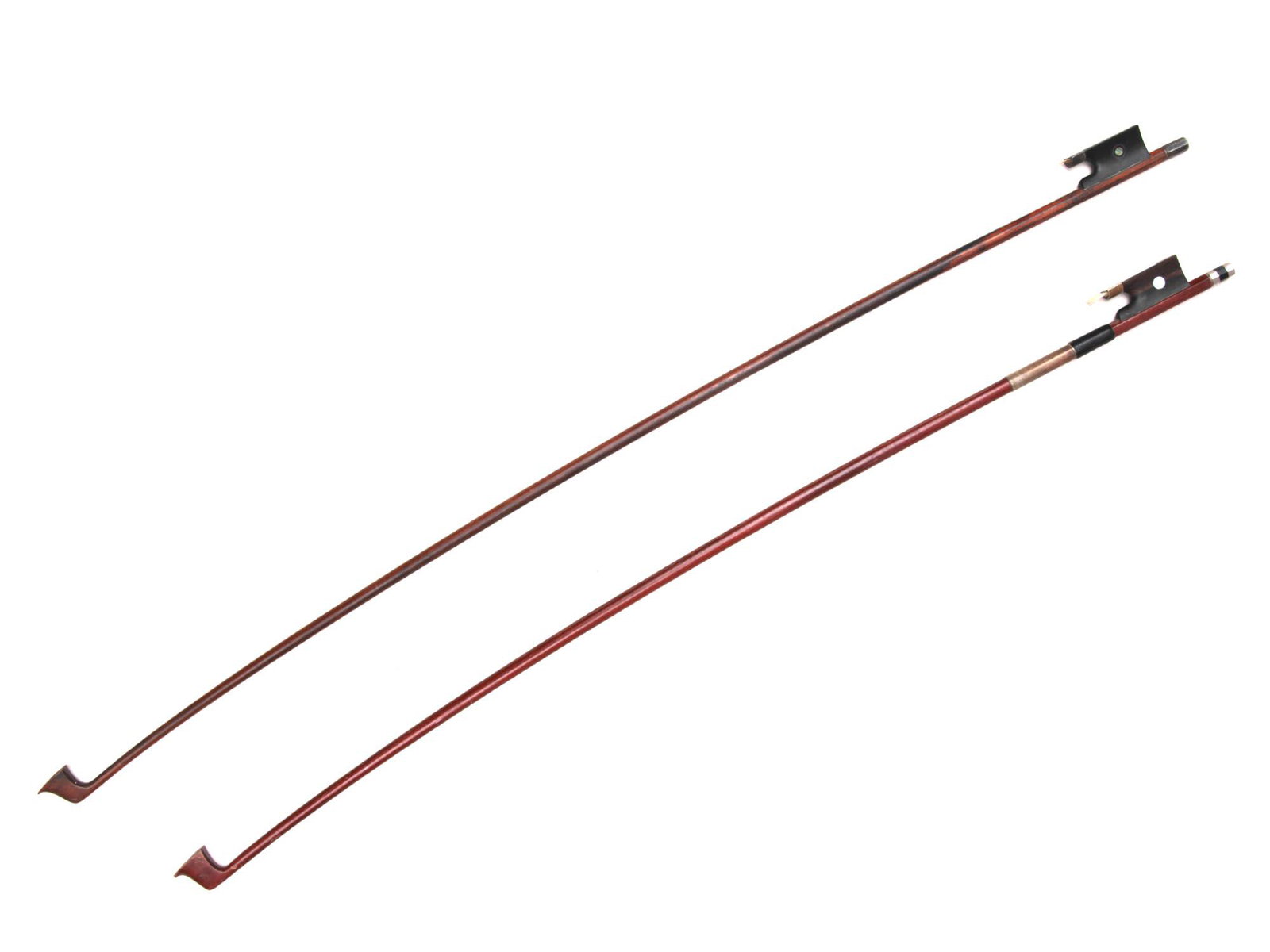 TWO ANTIQUE VIOLIN BOWS. 20TH C.: A pad with mother of pearl insert. The bows do not have a part with hair, it can be restored. Dimensions: L1: 26 1/2 in., (67.3 cm.)L2: 29 in., (73.7 cm.)