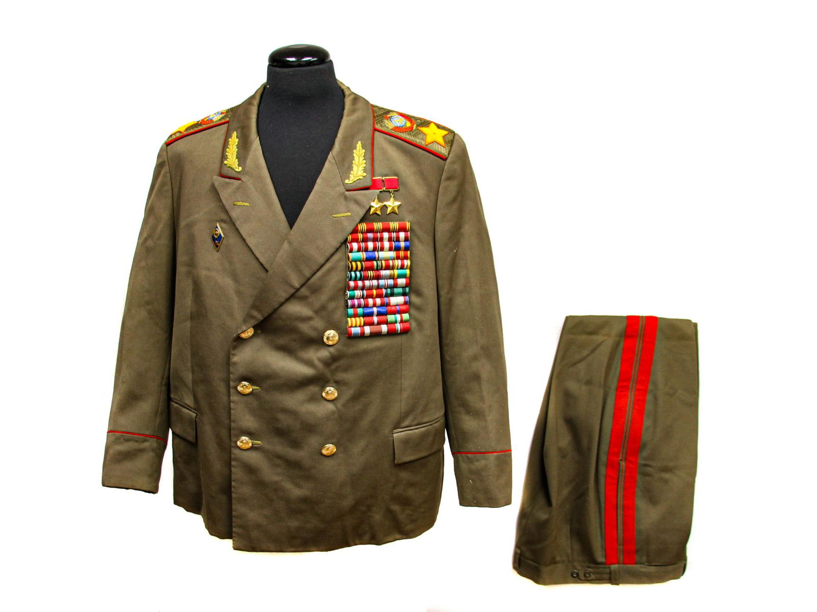 A MARSHAL OF THE SOVIET UNION ARMY UNIFORM: A uniform of the Marshal of the Soviet Union includes jacket and trousers; two Stars of the Hero of the Soviet Union are reproductions.The two orders on the Hero of the Soviet Union are replicas. Dime