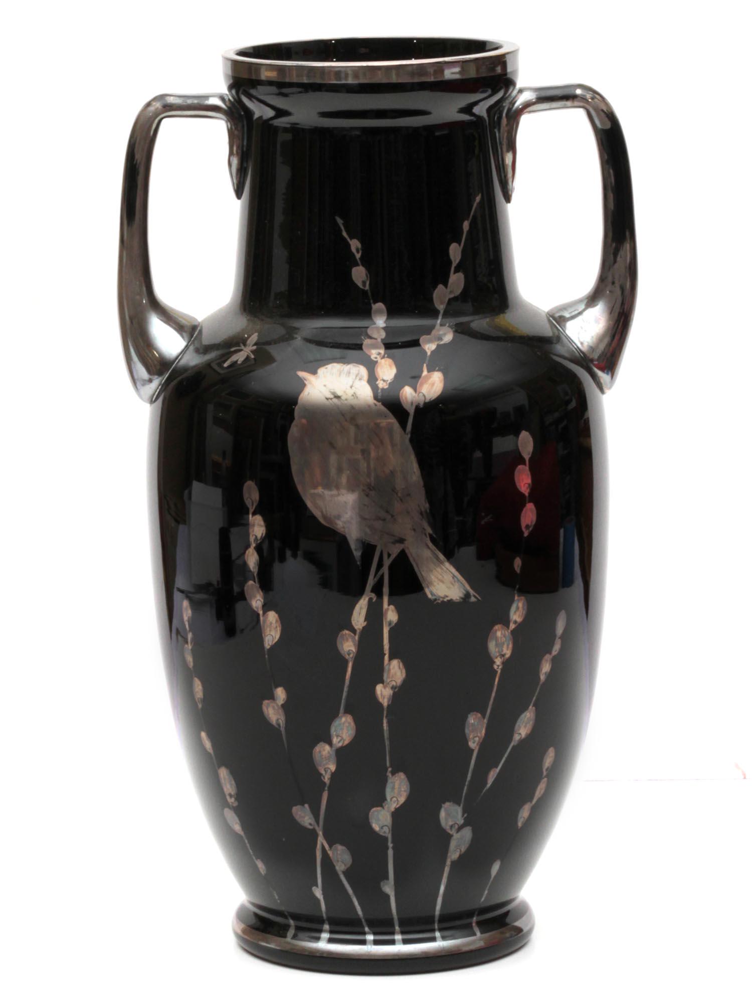 A CZECH VINTAGE SILVERED AND ENAMELED GLASS VASE: An elegant Czech vase made of glass with black enamel and silvered decoration. The aesthetic design depicts a nightingale sitting in willow branches and butterflies fluttering around. Marked on base: 