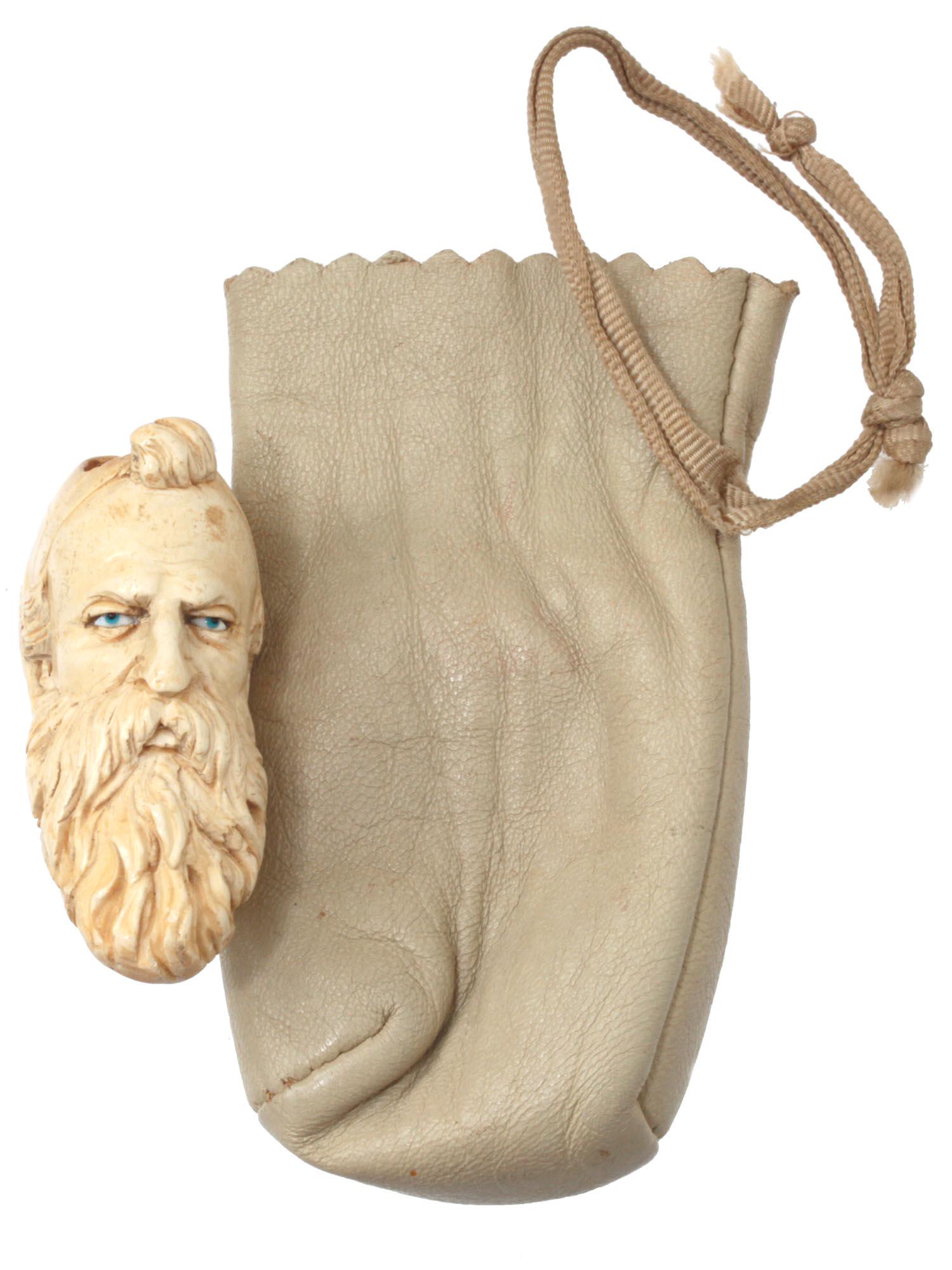 AN ANTIQUE CARVED MEERSCHAUM PIPE BOWL 19TH C: An antique carved meerschaum pipe bowl hand carved in the form of the head of a bearded man. The eyes are covered with enamel. Masterful carving that accurately conveys facial features and features of