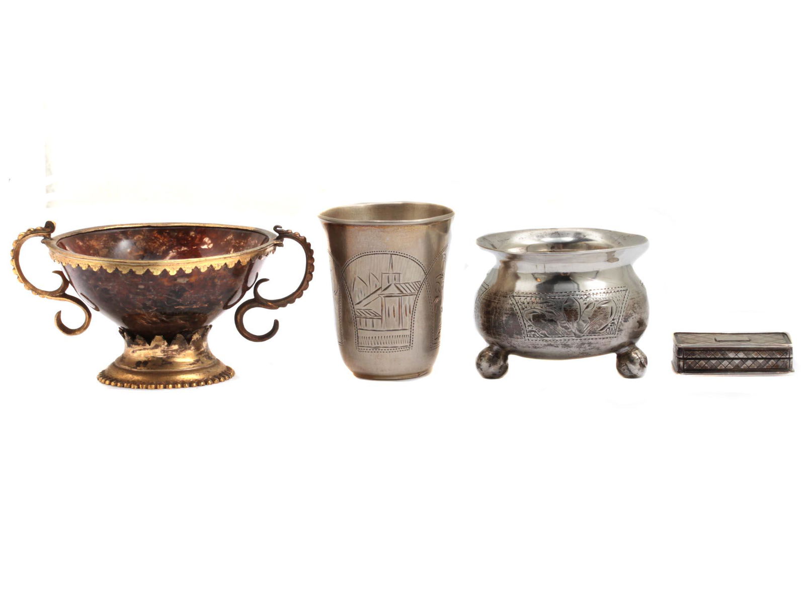 A SET OF THREE RUSSIAN SILVER PIECES AND ANOTHER: 1) An elegant cup with two handles, rim and base in gilded bronze. The body of the bowl is most likely made of a polished semi-precious stone (possibly amber).2) A Russian engraved silver vodka cup. M