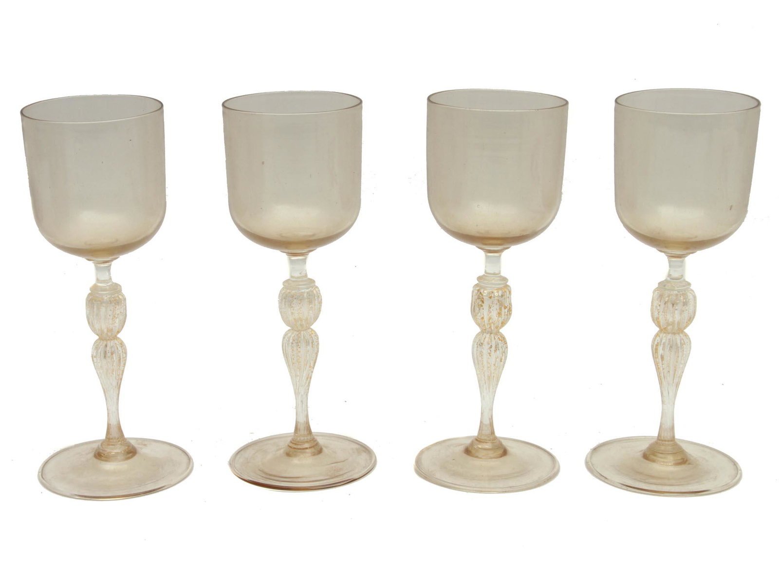 A SET OF FOUR WINE GLASSES LATE 19TH C: A late 19th century set of four light yellow wine glasses with beautiful fluted stems. Dimensions: H: 8 in., (20 cm.)